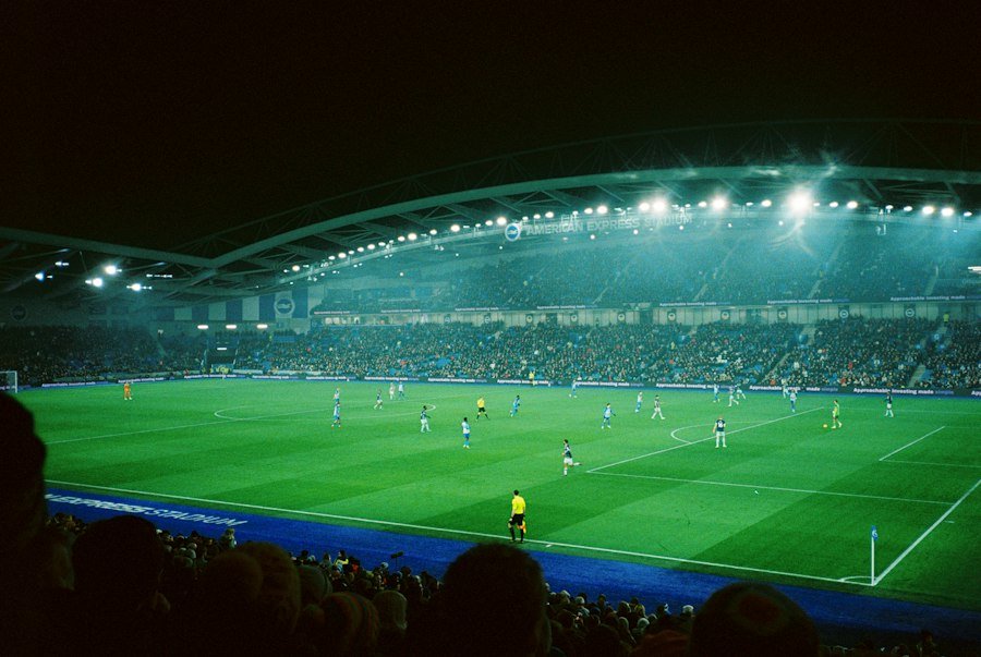 Stade de football éclairé la nuit